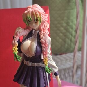 Pink and Green Braided Hair Figure